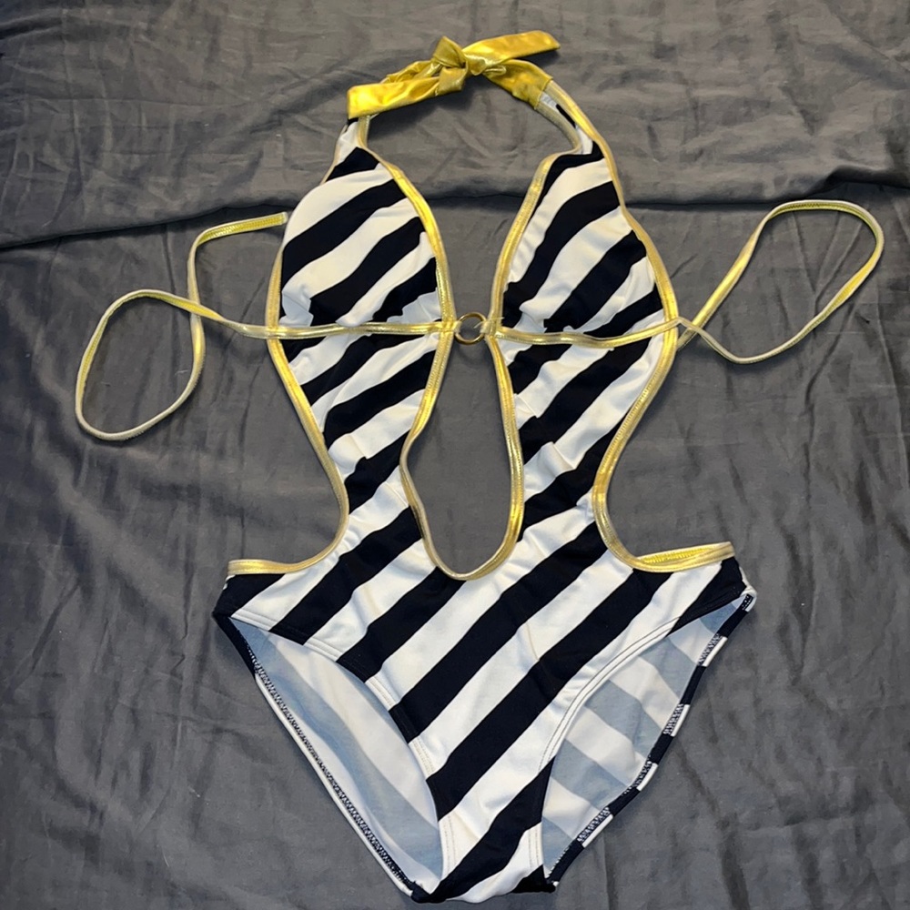 Large swimsuit with gold trimmings